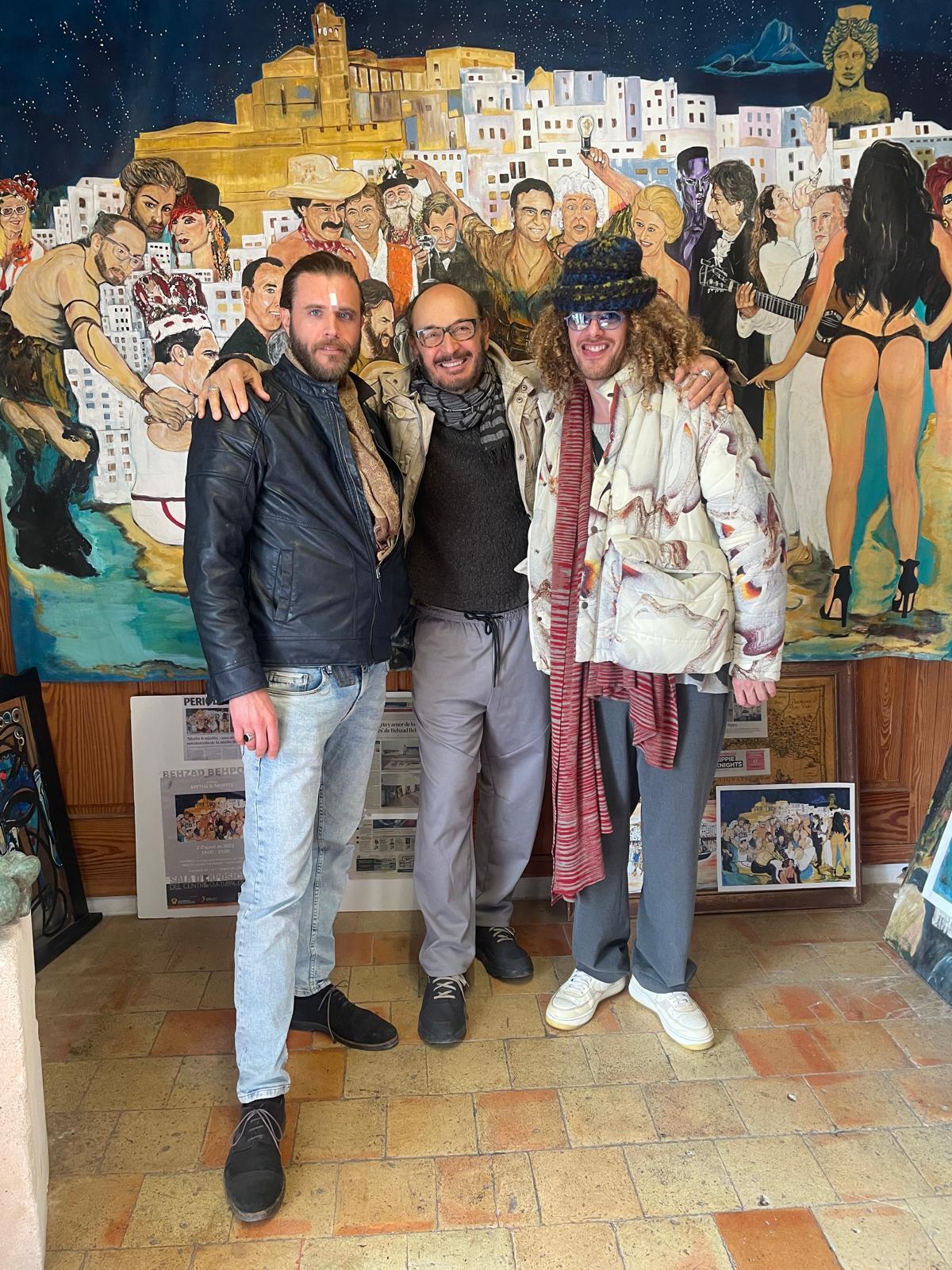Three guests in front of the fiesta canvas in the gallery