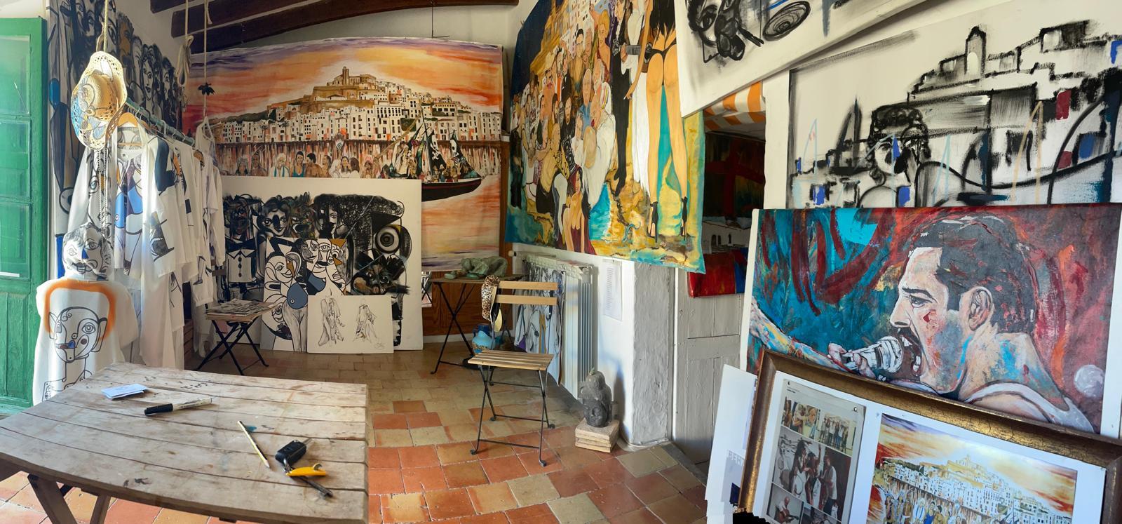 The San Juan studio, canvases stacked and hung along every wall