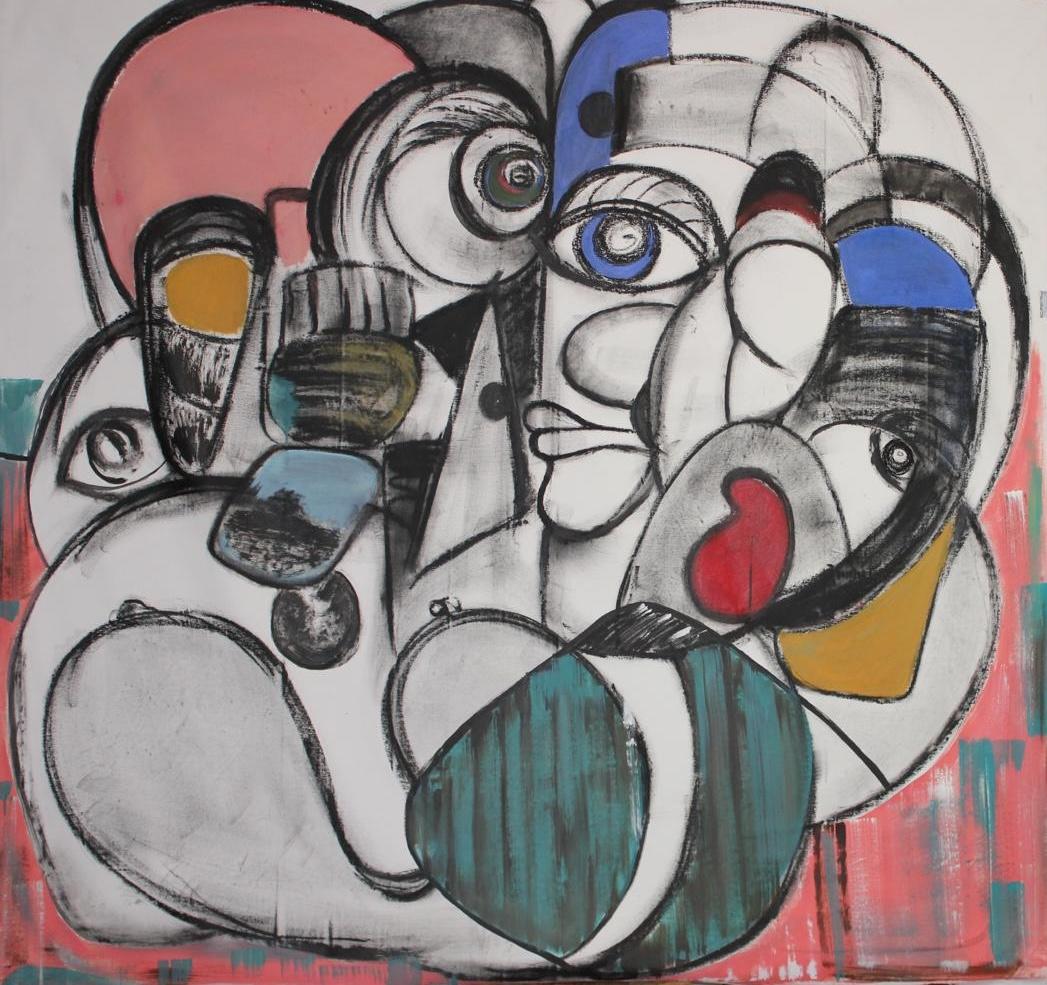 A large cubist head built from blocks of pink, teal and blue